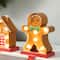 Glitzhome® Marquee LED Gingerbread House & Gingerbread Man Christmas Stocking Holder Set